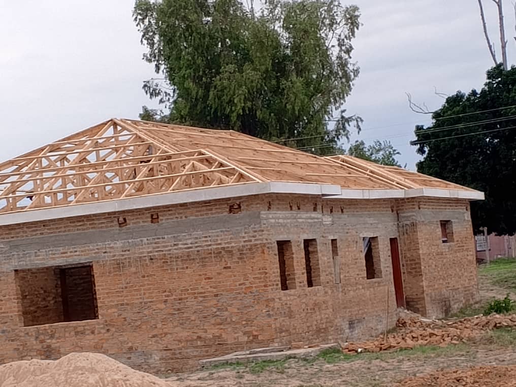 Envisage Valli Investments — Brick house with wooden roof trusses under construction